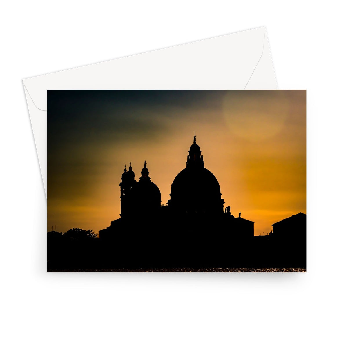Silhouette of Santa Maria della Salute on the Grand Canal in Venice against a golden sky at sunset. Italy. Greeting Card