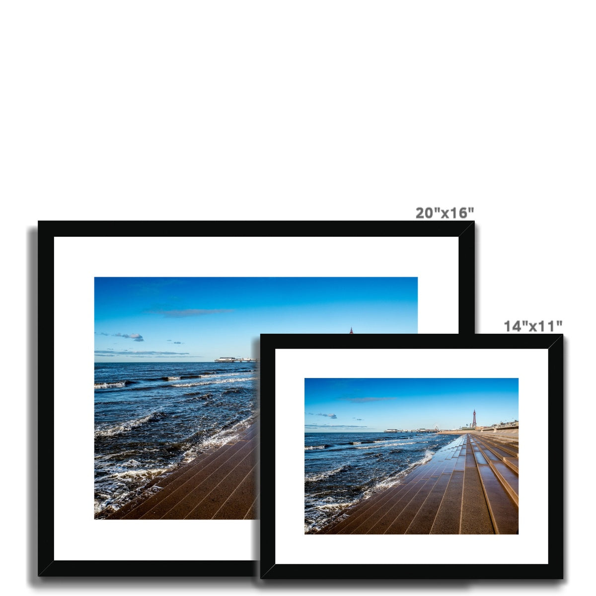 Blackpool's stone stepped sea defences with Blackpool Tower and Central Pier in the distance, Blackpool, UK. Framed & Mounted Print
