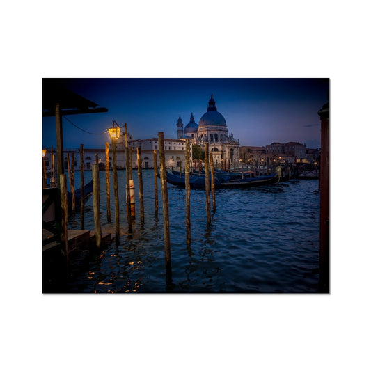 Gondolas moored for the night on the Grand Canal with the church of Santa Maria della Salute in the background. Venice, Italy. - Fine Art Print