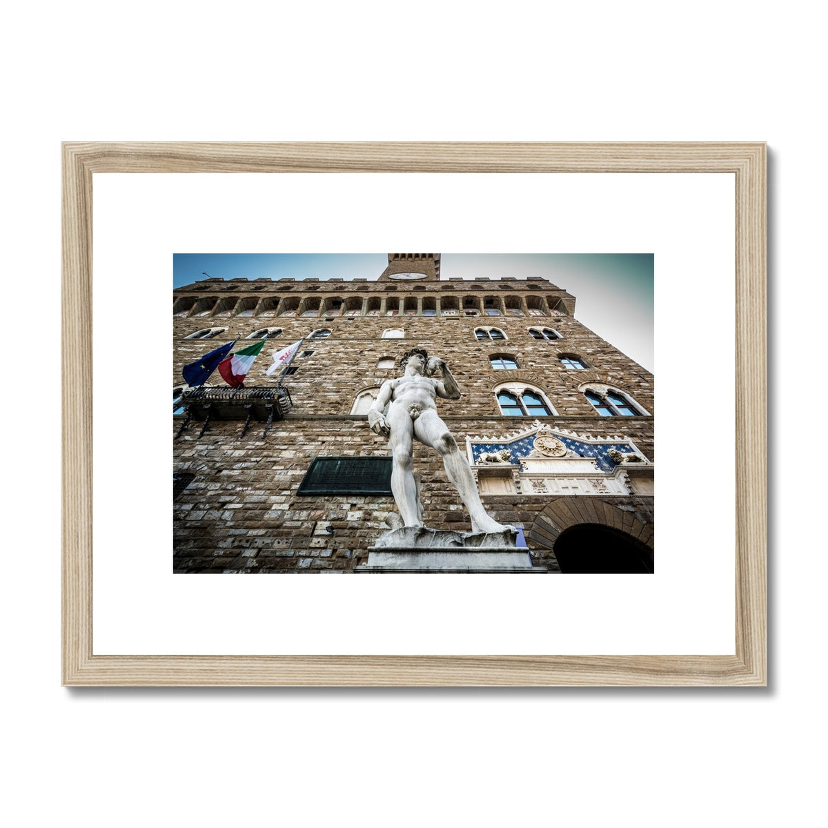 Statue of David overlooking Piazza della Signoria, with Palazzo Vecchio behind. Florence, Italy. Framed & Mounted Print