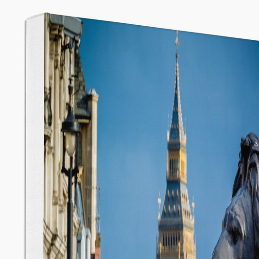 Lion statue in Trafalgar Square, with Big ben in background, London. Canvas