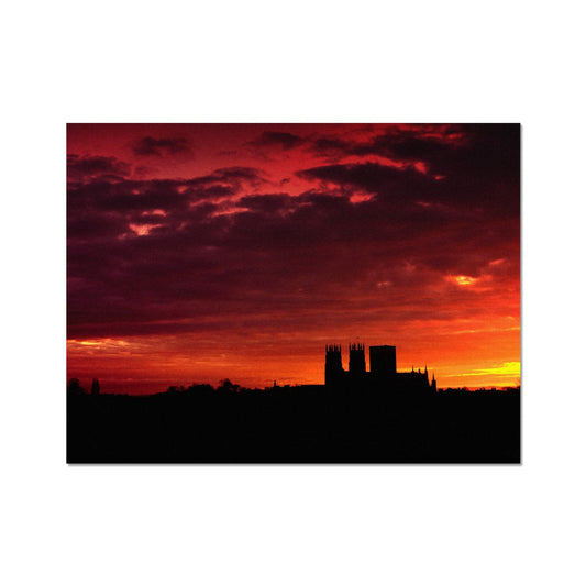 York Minster silhouetted against an orange sky at sunrise Fine Art Print