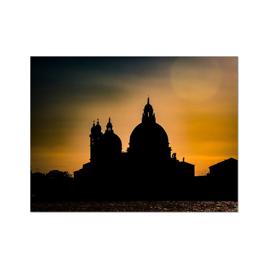 Silhouette of Santa Maria della Salute on the Grand Canal in Venice against a golden sky at sunset. Italy. Fine Art Print