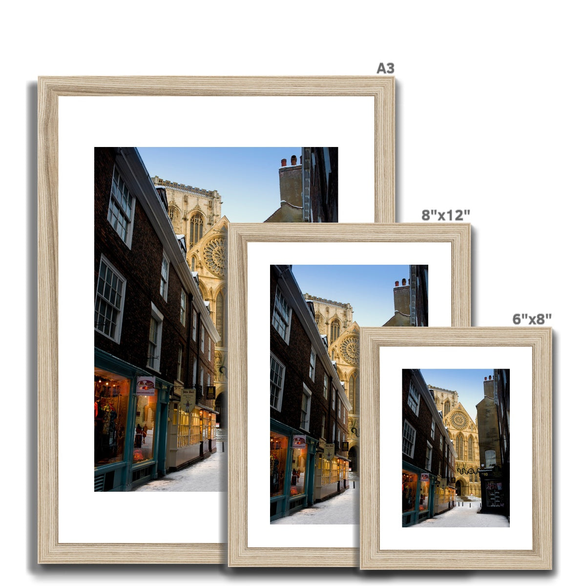 South entrance to York Minster with the Rose window seen from Minster Gates in the snow, York, UK. Framed & Mounted Print