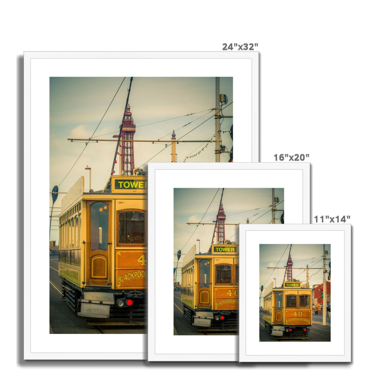 Traditional tram running along seafront promenade with Blackpool Tower in background - Blackpool,UK. Framed & Mounted Print