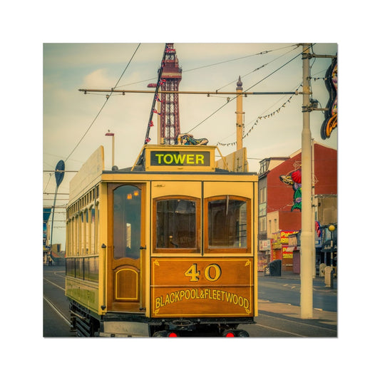 Traditional tram running along seafront promenade with Blackpool Tower in background - Blackpool,UK. Fine Art Print