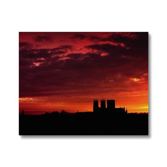 York Minster silhouetted against an orange sky at sunrise Canvas