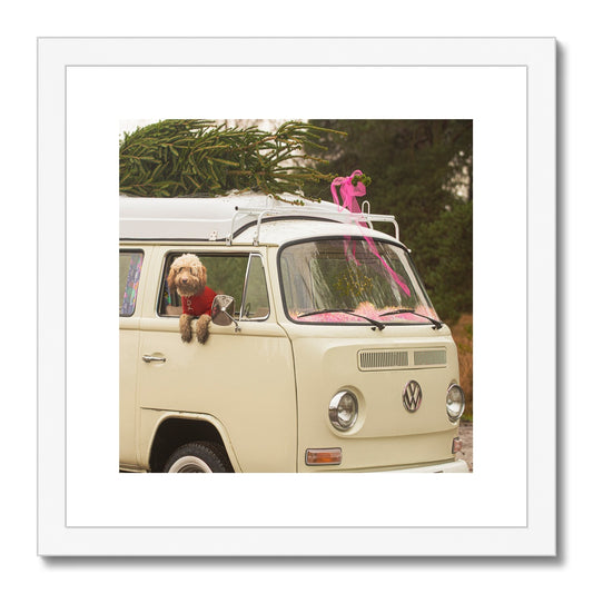 1972 VW Bay Window Campervan parked with with Christmas tree on roof and Cockapoo dog looking out of window. Framed & Mounted Print