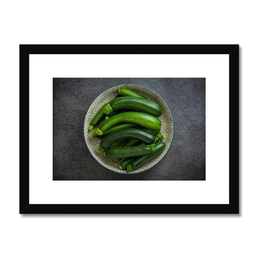 Bowl of green courgettes Framed & Mounted Print