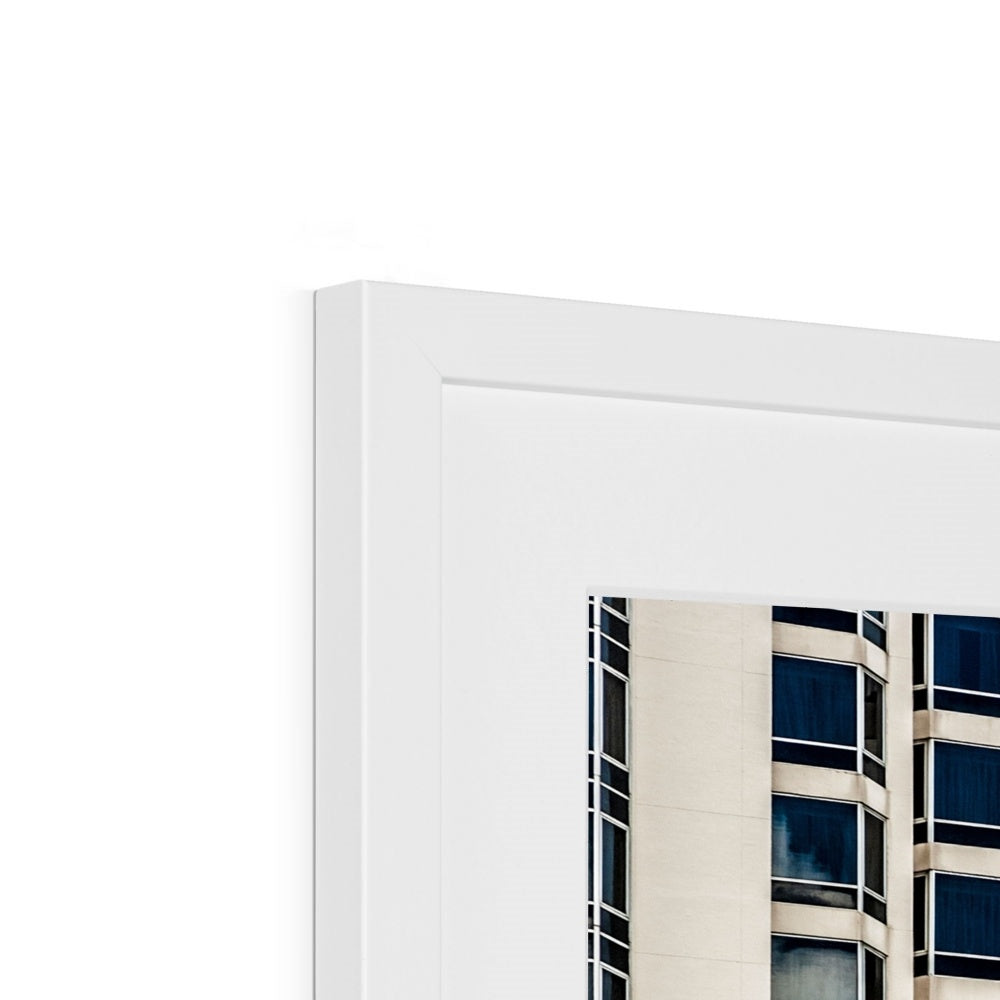 Symmetrical pattern of windows on contemporary skyscraper Framed & Mounted Print