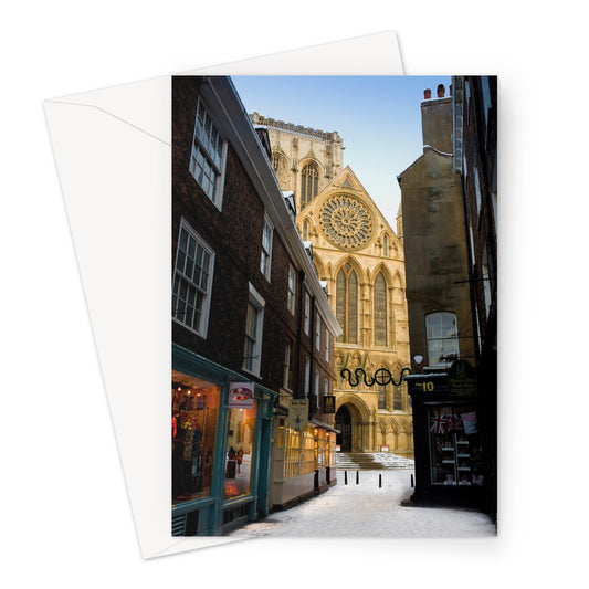 South entrance to York Minster with the Rose window seen from Minster Gates in the snow, York, UK. Greeting Card