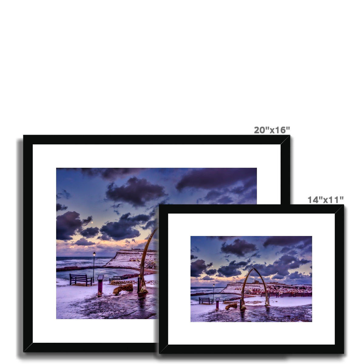 Whalebone Arch and view of Whitby Abbey in snow, Whitby, UK. Framed & Mounted Print