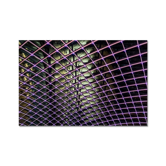 Illuminated grid pattern on a glass ceiling captured at night Fine Art Print