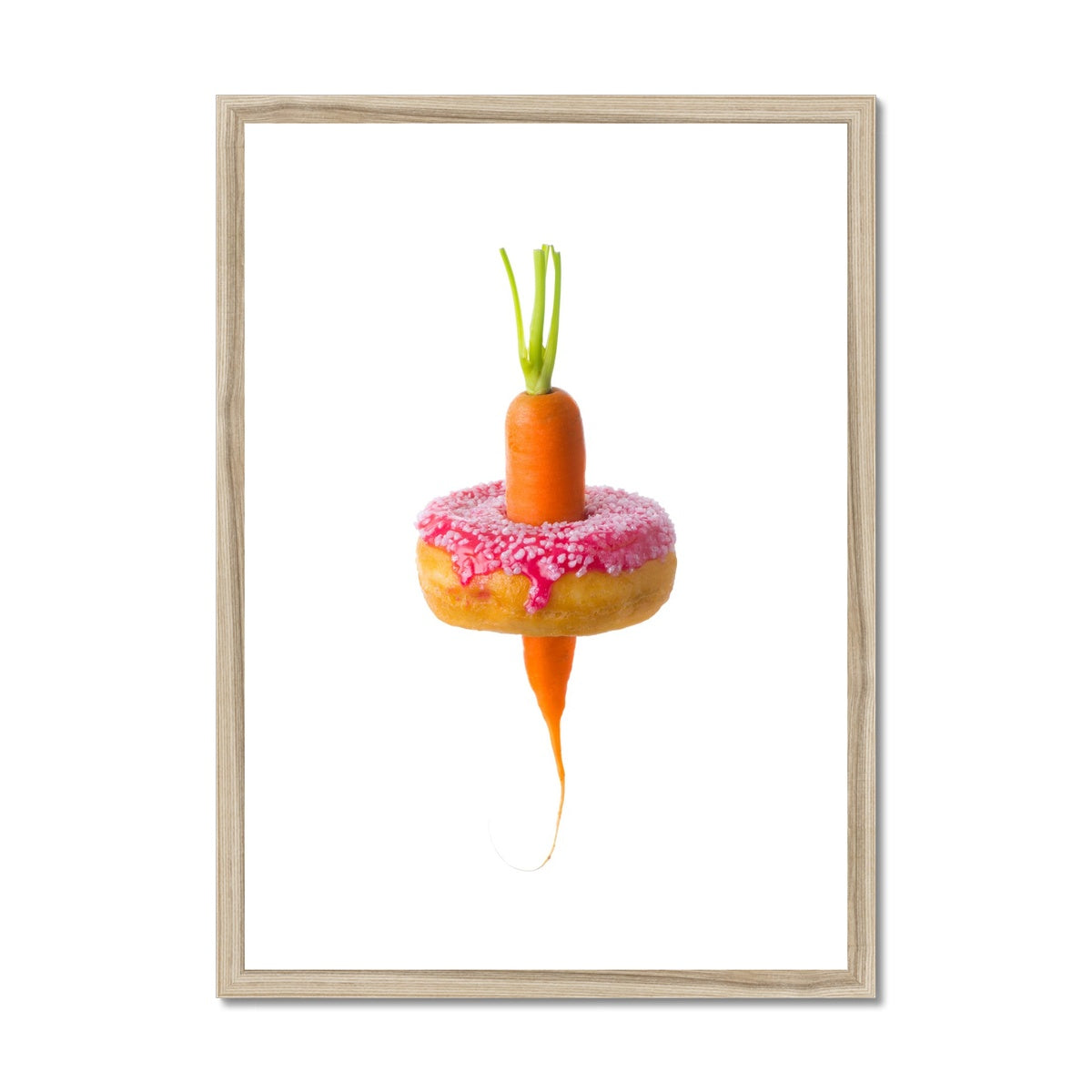 Carrot through a doughnut demonstrating healthy versus unhealthy food choices.  Framed & Mounted Print