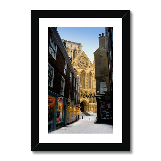 South entrance to York Minster with the Rose window seen from Minster Gates in the snow, York, UK. Framed & Mounted Print