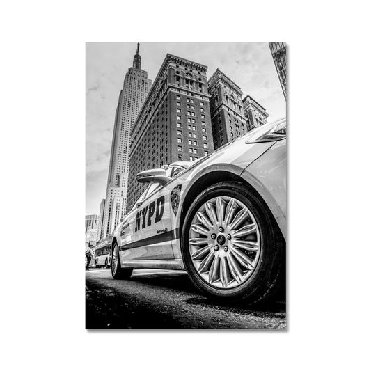 NYPD patrol car with Empire State Building on W 34th St, New York City, USA. Fine Art Print