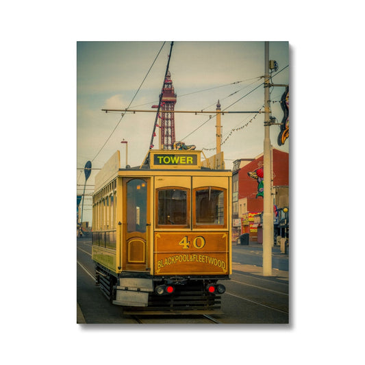 Traditional tram running along seafront promenade with Blackpool Tower in background - Blackpool,UK. Canvas