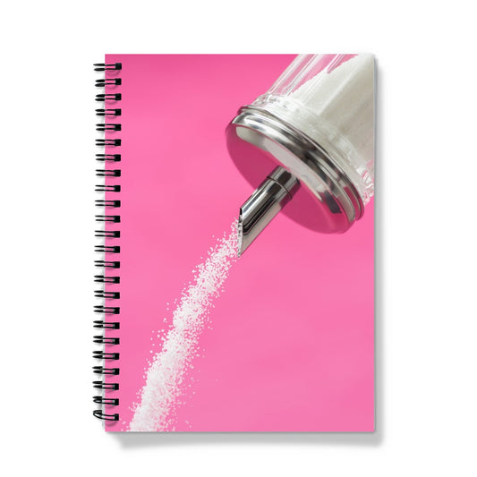Sugar dispenser pouring against pink background Notebook