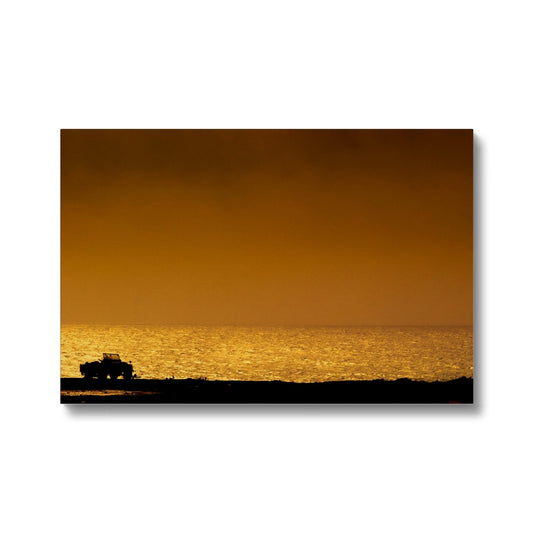 Silhouette of jeep on beach at sunset Canvas