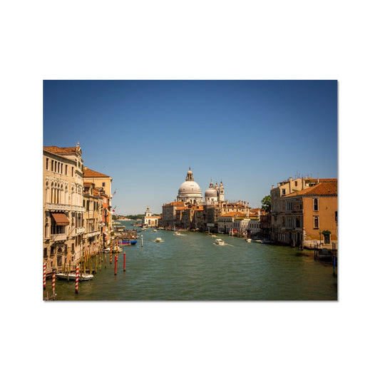 Grand canal in Venice with the domes of the church Santa Maria della  Salute in the distance Fine Art Print