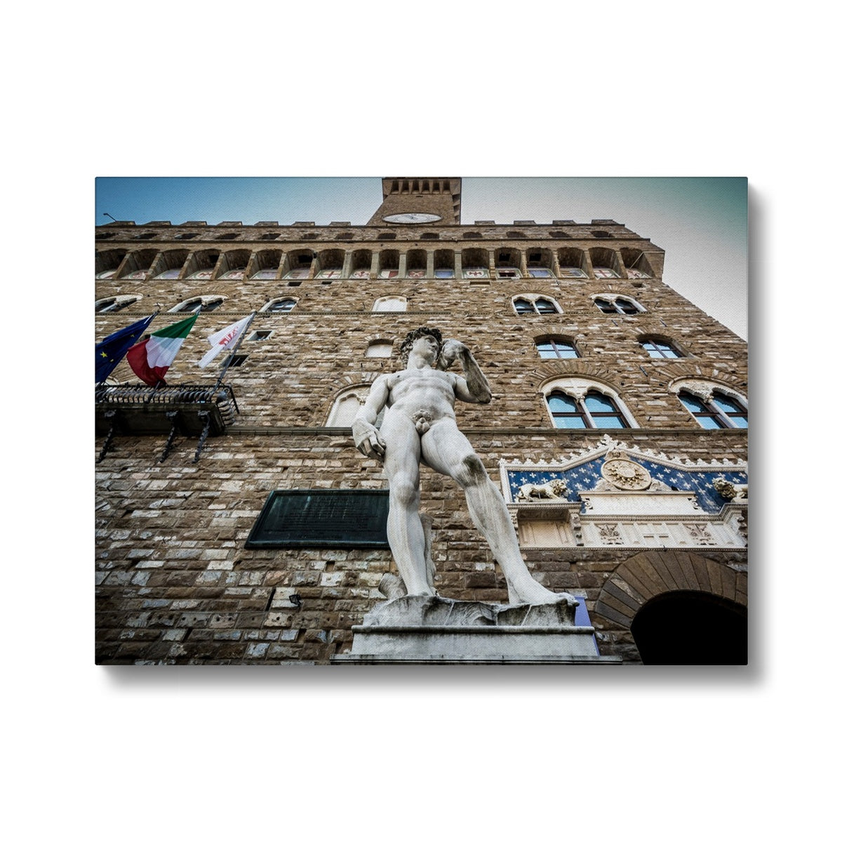 Statue of David overlooking Piazza della Signoria, with Palazzo Vecchio behind. Florence, Italy. Canvas