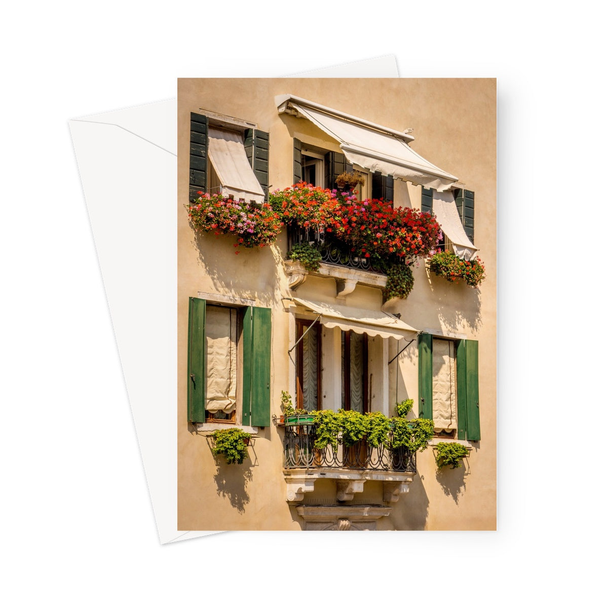 Traditional canal-side cream-rendered house with shuttered windows and window boxes. Venice. Italy. Greeting Card