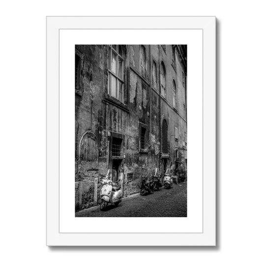 Typical street with parked scooters in the centre of Rome. Italy. Framed & Mounted Print