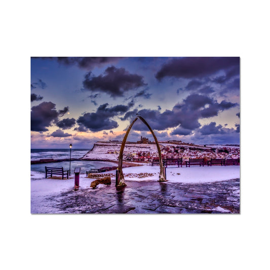 Whalebone Arch and view of Whitby Abbey in snow, Whitby, UK. Fine Art Print