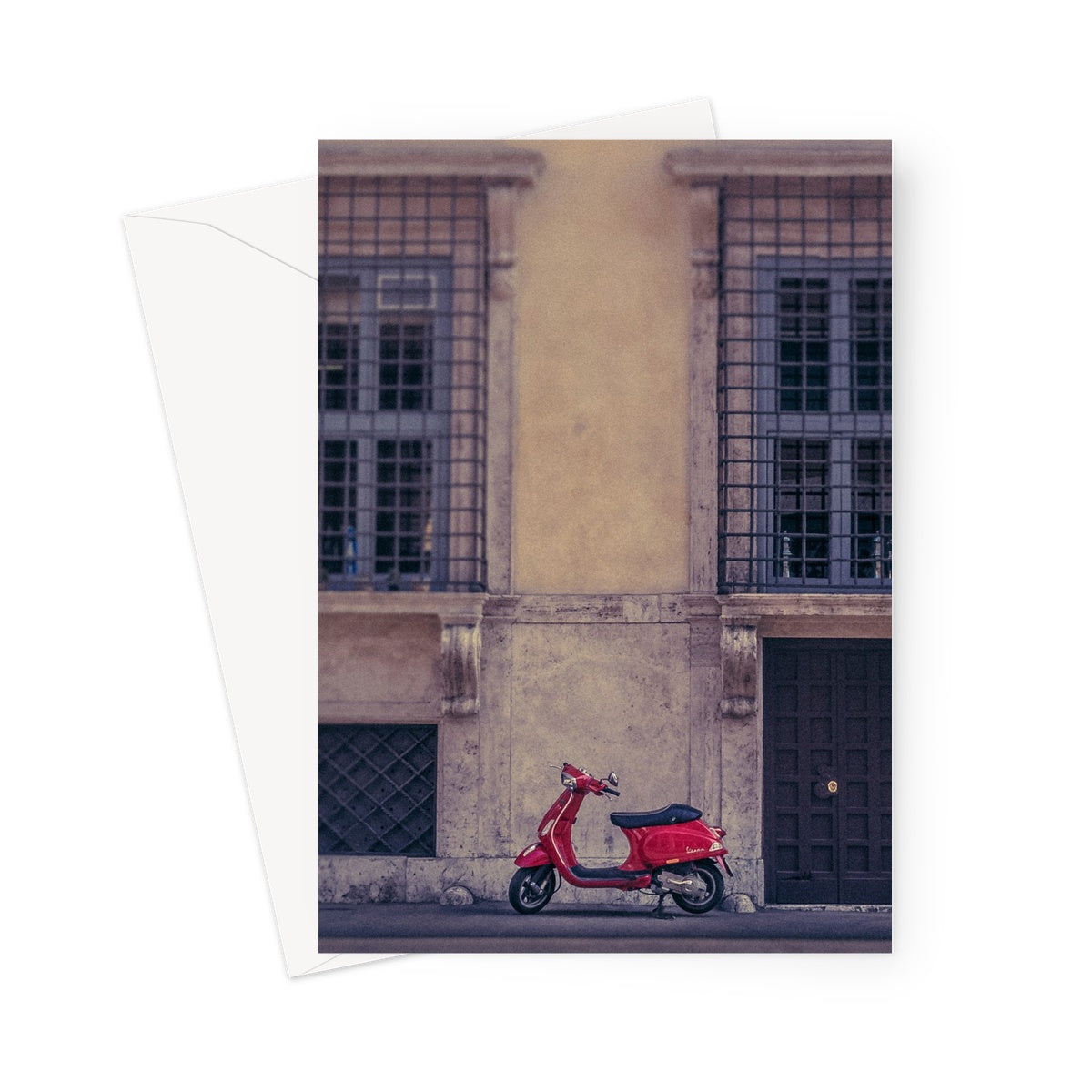 Red scooter parked outside a building in Rome, Italy. Greeting Card