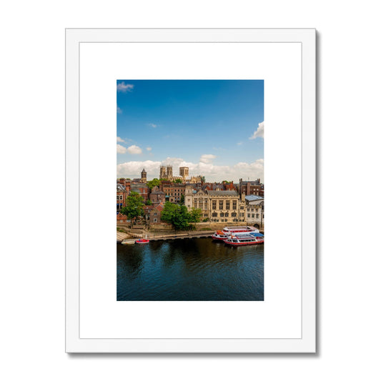 Moored boats on the River Ouse with the Guildhall and York Minster in the distance. York. UK Framed & Mounted Print