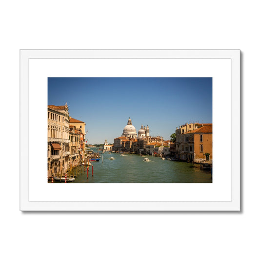 Grand canal in Venice with the domes of the church Santa Maria della  Salute in the distance Framed & Mounted Print