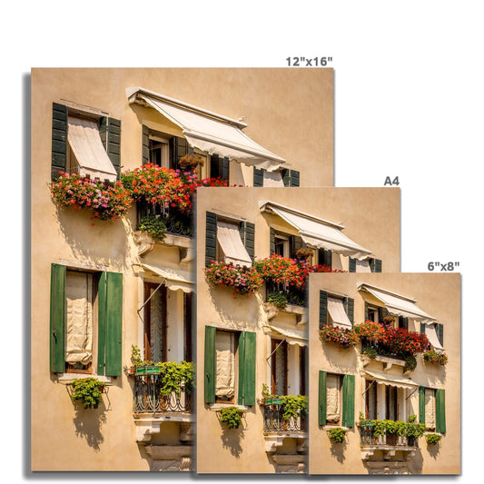 Traditional canal-side cream-rendered house with shuttered windows and window boxes. Venice. Italy. Fine Art Print