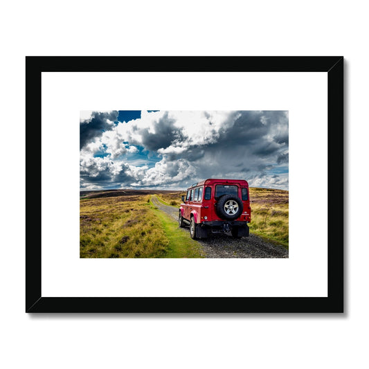 Red Land Rover Defender 110 4WD car navigating a Green Lane track, North Yorkshire Moors, UK. Framed & Mounted Print
