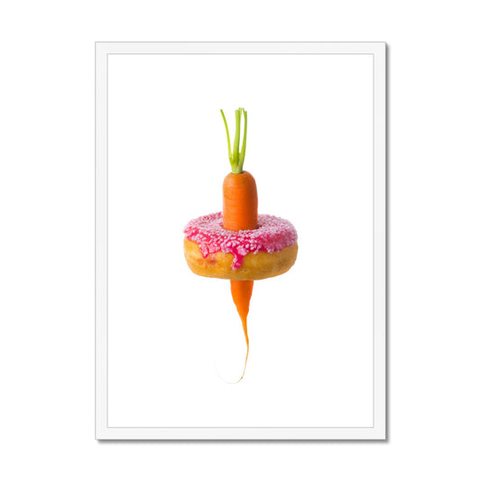 Carrot through a doughnut demonstrating healthy versus unhealthy food choices.  Framed & Mounted Print