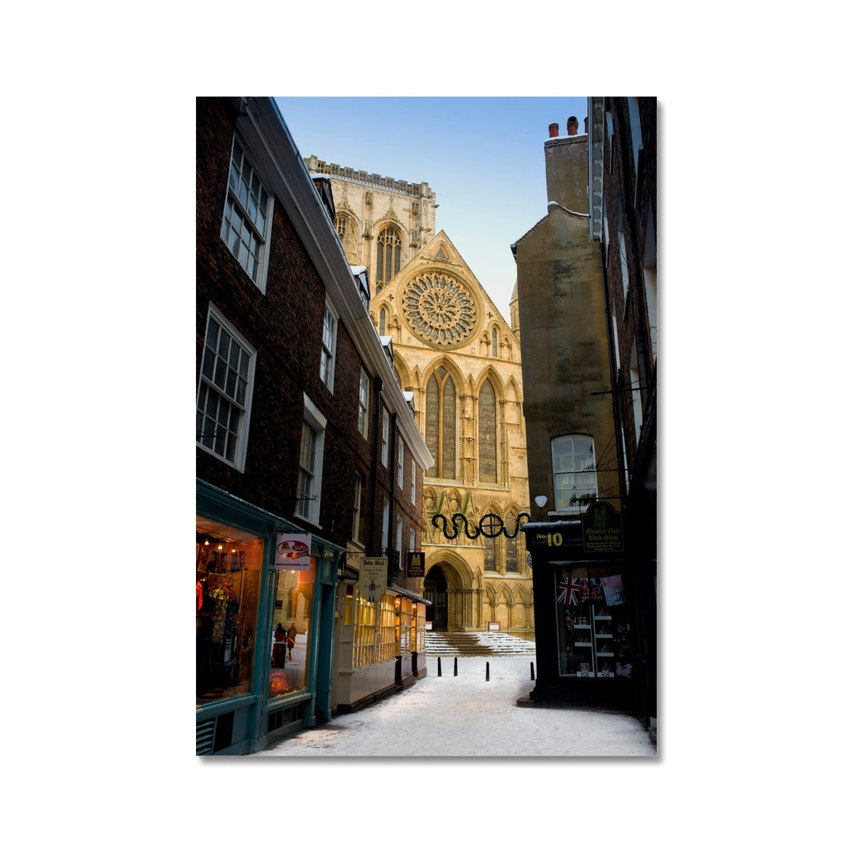 South entrance to York Minster with the Rose window seen from Minster Gates in the snow, York, UK. Fine Art Print