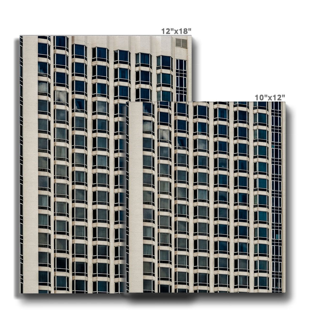 Symmetrical pattern of windows on contemporary skyscraper Canvas