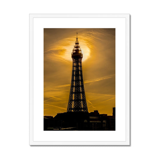 Blackpool Tower silhouetted against morning sunlight. UK. Framed & Mounted Print