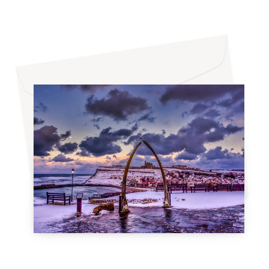 Whalebone Arch and view of Whitby Abbey in snow, Whitby, UK. Greeting Card