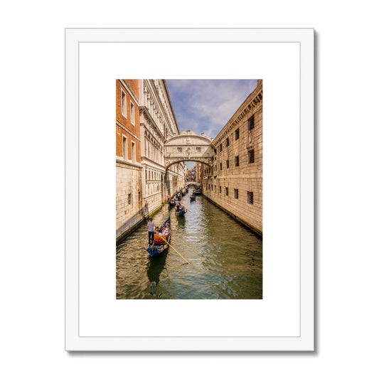 Gondolas passing under the Bridge of sighs. Venice. Italy. Framed & Mounted Print