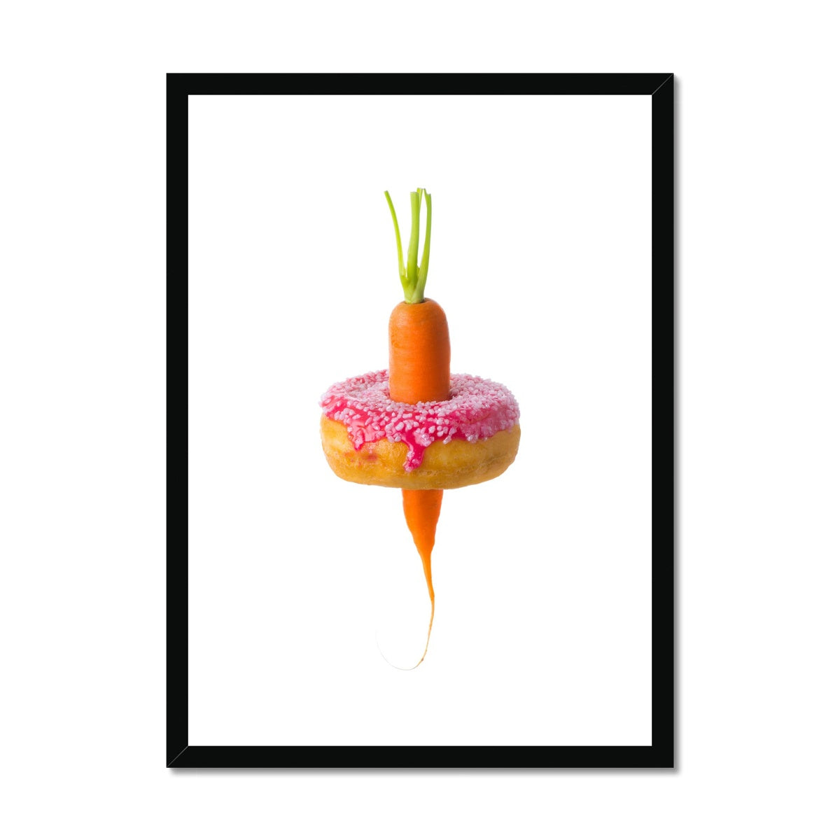 Carrot through a doughnut demonstrating healthy versus unhealthy food choices.  Framed & Mounted Print