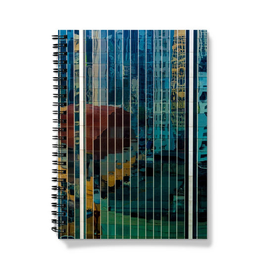 Urban reflections dance across a skyscraper's glazed facade Notebook