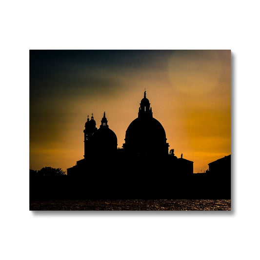 Silhouette of Santa Maria della Salute on the Grand Canal in Venice against a golden sky at sunset. Italy. Canvas