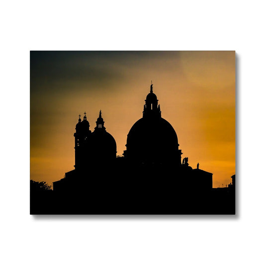 Silhouette of Santa Maria della Salute on the Grand Canal in Venice against a golden sky at sunset. Italy. Canvas