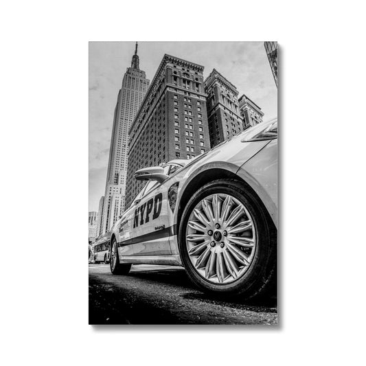 NYPD patrol car with Empire State Building on W 34th St, New York City, USA. Canvas