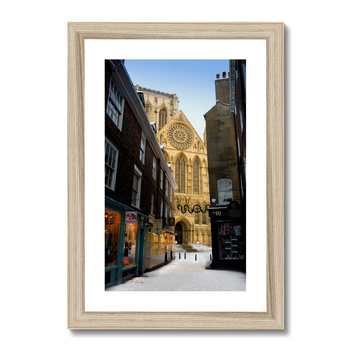 South entrance to York Minster with the Rose window seen from Minster Gates in the snow, York, UK. Framed & Mounted Print