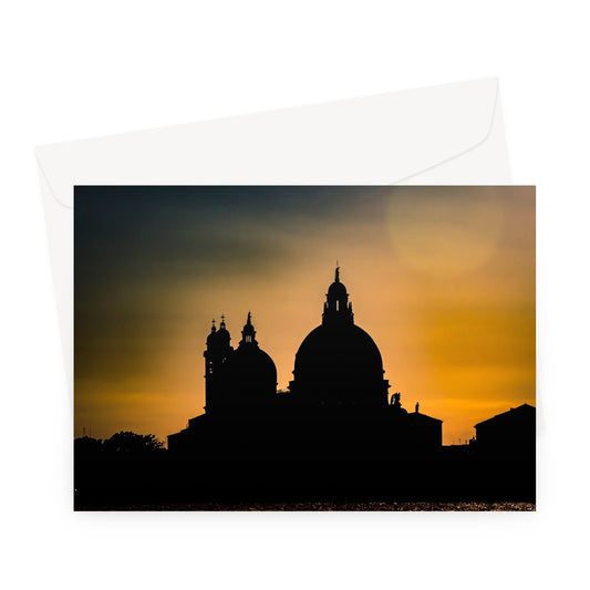 Silhouette of Santa Maria della Salute on the Grand Canal in Venice against a golden sky at sunset. Italy. Greeting Card