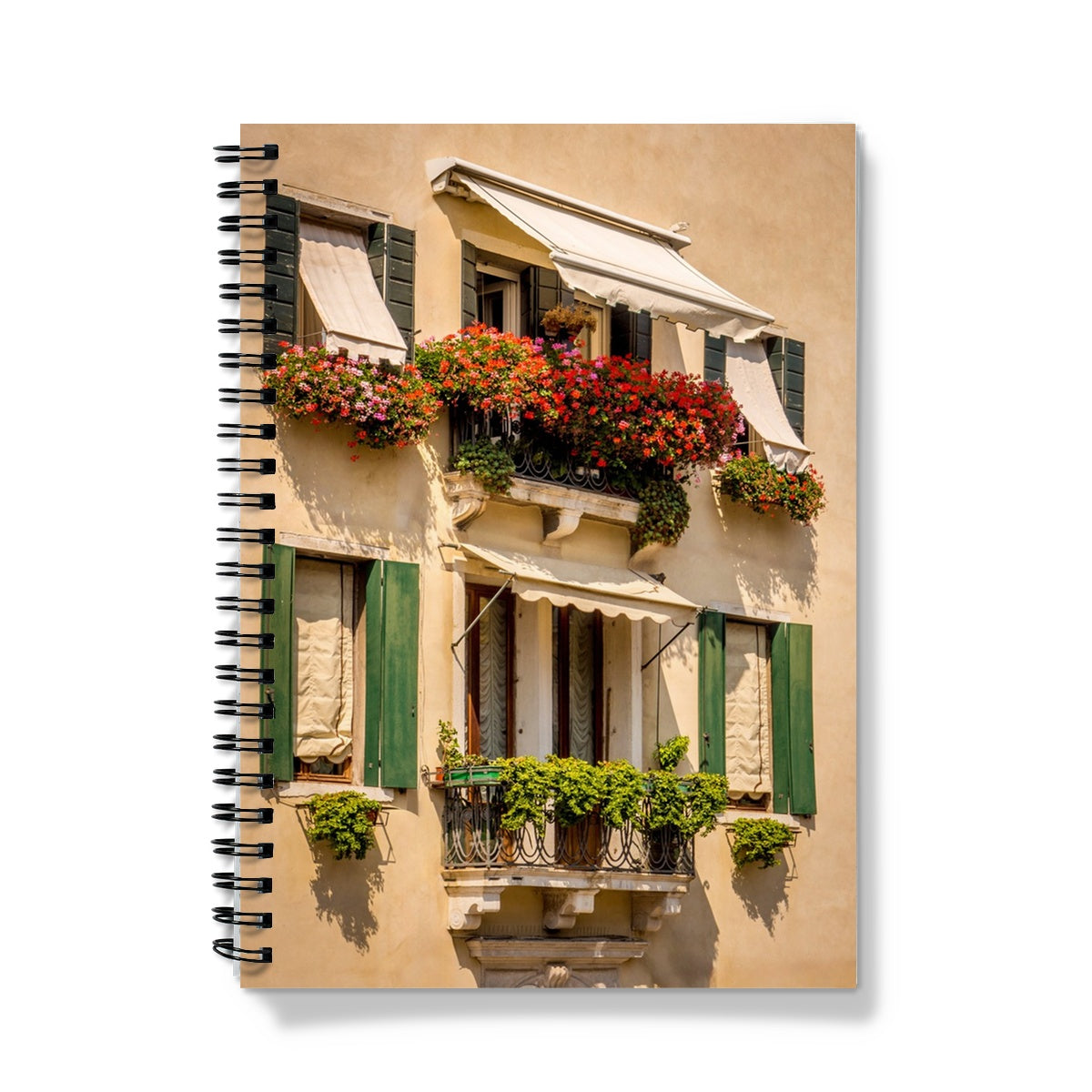 Traditional canal-side cream-rendered house with shuttered windows and window boxes. Venice. Italy. Notebook