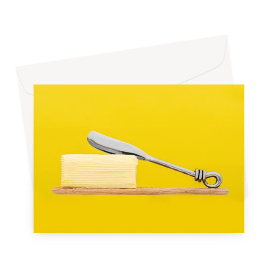 Homemade butter on wooden paddle with butter knife and yellow background. Greeting Card