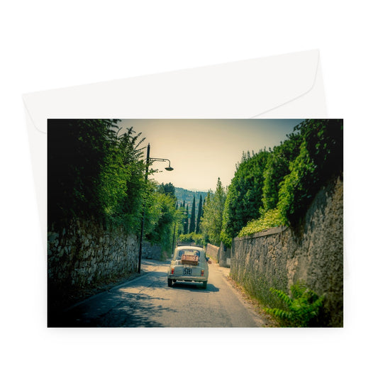Classic Fiat 500 car driving on a road in Florence, Italy. Greeting Card