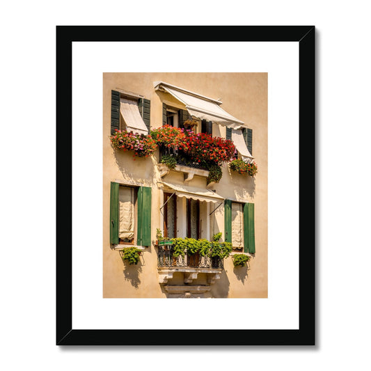 Traditional canal-side cream-rendered house with shuttered windows and window boxes. Venice. Italy. Framed & Mounted Print
